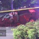 A wrecked car on the side of the road in Charlotte, NC, highlighting the dangers of car accidents in the city.