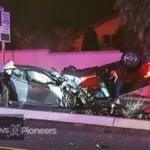 Emergency services at the scene of 'dominique brown car accident', with police cars and ambulances surrounding the crash site.