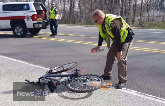 A cyclist rides along Alpine Road, where the Portola Valley care bike accident occurred, highlighting the need for improved safety measures.