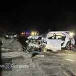 Emergency services at the scene of a 'woodtv news car accident' with police tape in the foreground