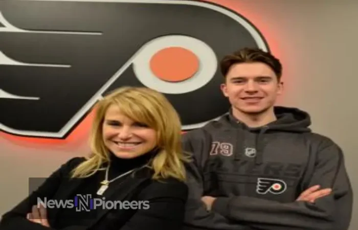 Carter Hart Wife Kaitlyn supporting him at a Flyers game, showcasing their private yet strong relationship.