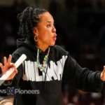 "Dawn Staley coaching South Carolina Gamecocks to victory, showcasing her legendary leadership in women's basketball.