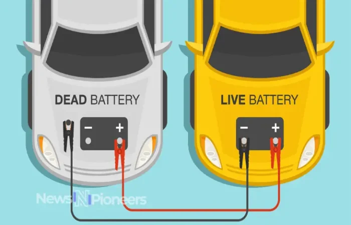 A person demonstrating how to jump-start a car safely using jumper cables.